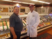 Andy Konstantakopoulos, left, owner of A.N.S. Seafood, with his son-in-law Paul Zorbas in front of their counter at Key Food in Pleasantville. Martin Wilbur photo 