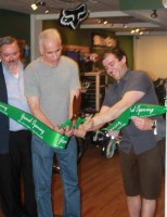 Stefan Pappalardo cuts the ribbon at last month's grand opening of his bicycle shop, Ride of Pleasantville. Ed Elliott photo.