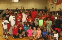 As Elton Brand (back row center) spends time with family and friends and conducts a basketball clinic for children during the 2015 Elton Brand Day at Peekskill High School, the crowd called for one more year, as Brand announced his retirement from the NBA, after a 16-year career. Albert Coqueran Photos