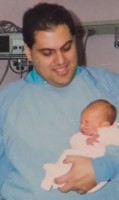 Dr. Jesus Jaile-Marti with Kathryn 21 years ago. Dr. Jaile-Marti still heads the NICU.