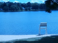 One of the beaches around Lake Carmel has been empty this summer because of blue-green algae blooms.