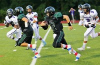Yorktown QB Jose Boyer breaks free for one of three TDs he would score in 51-27 rout of visiting John Jay CR last Friday.