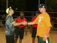 Time to get it on! Mansion on Broadway Manager Joe Pasqualini (left) shakes hands with Dunnes Pub Manager Bill Davis, Jr. (right), after Umpires Brian “Mookie” Fields (second left) and Anthony Nixon reviewed the ground rules and protocols before the start of the White Plains Rec Men’s Thursday Night Playoff Championship. 