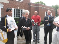 Town Board members Vishnu Patel and Susan Siegel address GOP allegations as Supervisor Michael Grace looks on. 