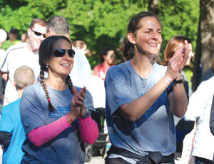 Michele Berliner, left, and Christy Saltstein, organizers of the Stayin’ Alive 5K Fun Run, recently distributed ,500 to the town’s police department and volunteer fire companies for new equipment.