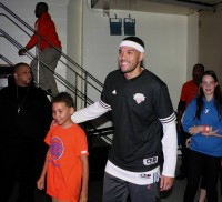 Louis Falasca (left), a sixth grade student from Alice E. Grady School in Elmsford, had a thrill of a lifetime when forward Sean Marshall (right) picked him as an escort during introductions at the Westchester Knicks Home Opener, Nov. 12. Albert Coqueran Photos