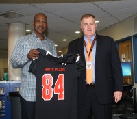 Art Monk (left) was presented with a replica of one of the uniform jersey’s he wore while playing at WPHS, by Athletic Director Matt Cameron. Monk graduated from WPHS in 1976, after having illustrious careers in football and track. Monk will be inducted as a member of the inaugural class of the White Plains High School Athletic Hall of Fame, on Friday, Nov. 13.