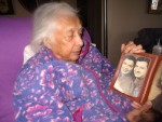 Marvelle Gilbert holds a picture of her and her late husband, Paul. After he died in 1997, she found in a drawer his first-hand account of the bombing at Pearl Harbor.