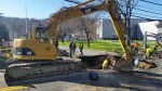 Crews work on Monday afternoon to repair giant sinkhole that appeared on Marble Avenue following a water main break Sunday night.