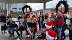 The Pleasantville High School Camerata Singers, in back, singing with the Chamber of Commerce Instrumental Ensemble last week.