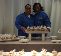 Dec. 8 NWE BOW G&K Owners Pix | The Examiner News Photo caption: New Rochelle resident Gay Wheeler-Smith, left, and Peekskill resident Kecia Palmer-Cousins, owners of G&K Sweet Foods LLC in Peekskill, are shown above with their sweet potato pies that were served at the 2014 Super Bowl VIP Tailgate Party at Met Life Stadium. Photo credit: G&K Sweet Foods LLC