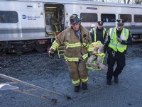 : Firefighters from the Brewster Fire Department participate in the Joint Emergency Exercise between Putnam County first responders and the MTA Metro-North Railroad. Photo provided by MTA/Patrick Cashin.