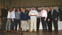 On behalf of the 2015 Stepinac Varsity Football Team, Captain Khaleb Celaj (center) presented a football signed by the team with the Stepinac insignia and inscribed “2015 NYS CHSAA Champions Undefeated Season” to the Crusaders Coaching Staff, as a thank you for their leadership and guidance throughout this remarkable season. Albert Coqueran Photos