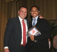 Stepinac Varsity Football Assistant Coach Jonathan Demarco presented Terrell “T.J.” Morrison (right) with the 2015 Stepinac Team Most Valuable Player Award, during the Stepinac Football Awards Dinner. 