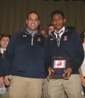 The 2015 Stepinac Football Junior Varsity Most Valuable Player Award was presented to running back/cornerback Justin Hairston (right) by Head Coach Joe Venice. 