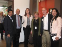 Dr. Rajesh Gupta (second from left), medical director of AFC Urgent Care in Yorktown, celebrates the opening of his facility.