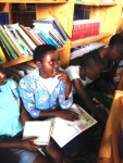 Children learn to read at a library at the Duha Complex School in Rwanda that was funded by the Katonah-based Rwanda Education Assistance Project.