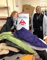 Peggy Robinson of The Woman’s Club of White Plains with Berna Diggs, Assistant Store Manager, Burlington Coat Factory, White Plains.