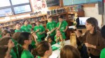 Dr. Martha Matteo shows trophies won by the Pleasantville Middle School Science Olympiad team to her team members. The team is competing in states this week.