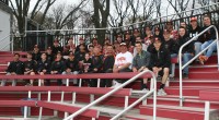 On Friday, WPHS Head Coach Marcel Galligani (front row center) brought the entire varsity and junior varsity Tigers teams to Jack Coffey Field in the Bronx, to watch his former star player Kyle Adams play for the University of Richmond against Fordham University. 