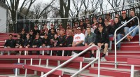 Adams-2 | The Examiner News On Friday, WPHS Head Coach Marcel Galligani (front row center) brought the entire varsity and junior varsity Tigers teams to Jack Coffey Field in the Bronx, to watch his former star player Kyle Adams play for the University of Richmond against Fordham University.