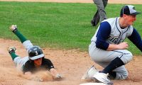 Yorktown SS Jake Bichler slides in safely to 3B as Put Valley's John Millicker fields throw in Huskers' 6-1 win over Tigers.