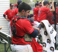 Stepinac catcher and field general Joe Silvestri adjusts his catcher’s equipment or “tools of ignorance” between innings. Silvestri’s guidance and defense behind the plate is so valuable to the Crusaders that Head Coach Keith Richardson noted. “Joe is a hard worker; he does a great job behind the plate. I do not know where we would be without him.” 