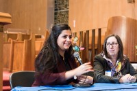 Sana Mustafa, a Syrian activist, who came to the United States in 2013, described her family’s struggle since the Syrian Civil War broke out in 2011 at a forum on the Syrian refugee crisis in White Plains earlier this month. Rev. Doris Dalton is pictured at her right. Photo courtesy of Andrew Courtney