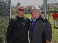 White Plains Head Coach Marcel Galligani (left) greets tournament namesake Joe McAvoy, before the start of the 13th Annual Joe McAvoy City Challenge, which pits City of White Plains rivals Tigers versus Crusaders on the diamond, at White Plains High School. Albert Coqueran Photos