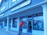 OLYMPUS DIGITAL CAMERA | The Examiner News Sal Triarsi of Cacciatori Pizzeria in Mahopac stands outside his restaurant with pride.