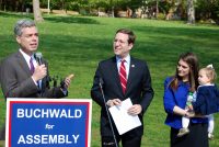 White Plains Mayor Tom Roach introduces Assemblyman David Buchwald as he announces his run for a third term in the New York State Assembly at Turnure Park in White Plains Monday. Buchwald’s wife Lara with daughter Anna look on. Andrew Vitelli Photo