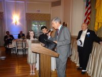 Mayor Tom Roach accepting a proclamation and silk top hat in honor of the City Centennial. Photos courtesy of White Plains Historical Society.