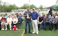The 2016 Eleanor Loucks Memorial Award was presented to Benny Cipriano (left) by Loucks Games Assistant Meet Director Nick Panaro, who was the 1994 recipient of the annual Eleanor Loucks Award. Cipriano is a native of White Plains and a 1977 graduate of WPHS. Cipriano worked for the White Plains Department of Public Works for 16 years before becoming the lead grounds keeper for the White Plains School District, where he has tenured for 15 years. 