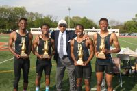 The Hackley High School Relay Team was presented “The Olympian” Trophy by Glenn D. Loucks Track & Field Games Chairman Daniel A. Woodard (center), after placing first in the Boy’s 4 x100 Relay. The Hackley Relay Team consists of (l-r), Darius Inzar, Elijah Ngbokoli, Anthony Roderick and Onye Ohia-Enyia. Roderick also placed second in the Boy’s 100 Meter Dash. 