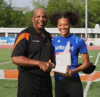 Alyssa Sandy (left) a senior from Paul Robeson High School was awarded the “Doc” Blanford Memorial Award as the Outstanding Female Runner of the 49th Annual Glenn D. Loucks Track & Field Games. Sandy placed first in the 100 and 400 Meters Hurdles. 
