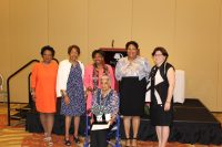 Lois Bronz (seated) was honored for a lifetime of community service. NYS Senator Andrea Stewart-Cousins stands behind Bronz and is flanked by members of the Lois Bronz Children’s Center Board.