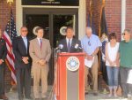 State Sen. George Latimer with, left to right, Harrison Police Chief Anthony Marraccini, Assemblyman David Buchwald and the parents of the two Harrison resident who recently died from taking tainted heroin. Seven suspects have been arrested in connection with the ring for selling the heroin in the community.