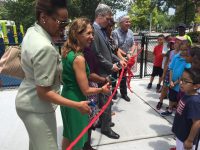 State Assemblywoman Amy Paulin, White Plains Mayor Tom Roach, members of the White Plains Common Council and staff of White Plains Recreation and Parks Department cut the ribbon to the newly renovated Kittrell Park.