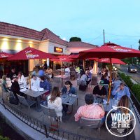 On a pleasant evening, the outdoor patio is a popular dining area at Wood & Fire Pizza in Pleasantville. 