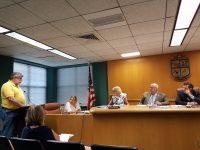 North Castle town board members listen to an update on paving by highway department foreman Jamie Norris, far left, and town administrator Joan Goldberg at their Aug. 10 meeting. The board decided against additional road paving this year. 