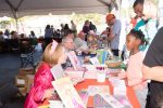 Author Victoria Kann visits with a young reader at the 2014 Chappaqua Children’s Book Festival.