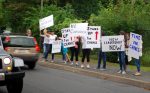 Parents protested across from the Chappaqua School District administrative offices near Horace Greeley High School on Monday morning. 