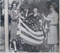 Mary Louise Reid Presents Flag to Woman’s Club Members Fran Bonnar and Mae Humes.