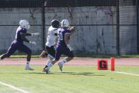 Tigers linebacker Chris Schiavone reaches out with the football as he crosses the goal line after he intercepted a pass and returned it 65 yards for a touchdown in the first half of the Section 1 Qualifying Round against New Rochelle on Saturday. Albert Coqueran Photos