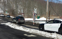 The troubled Roaring Brook Road grade crossing pictured here two winters ago. New Castle officials plan to make a push to build a bridge over the tracks and Saw Mill River Parkway.