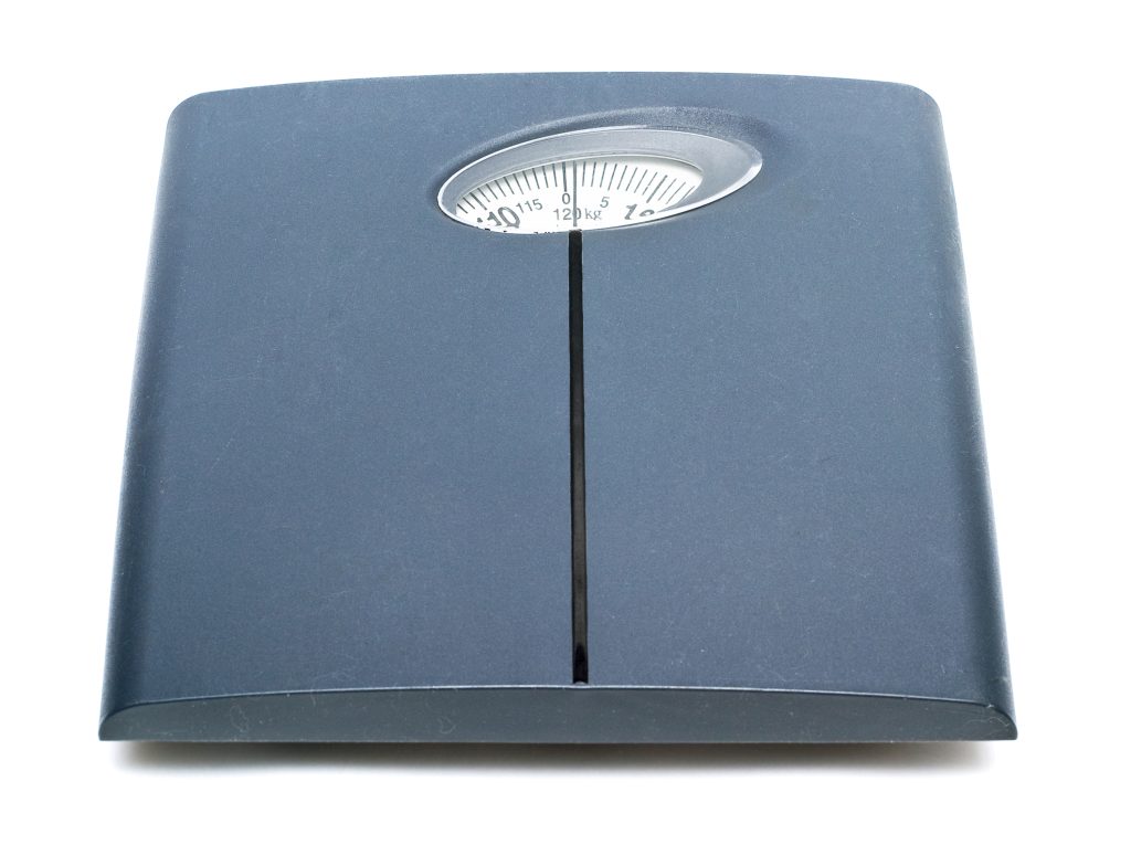 analog bathroom scales - grey scale with an oval window for reading weight