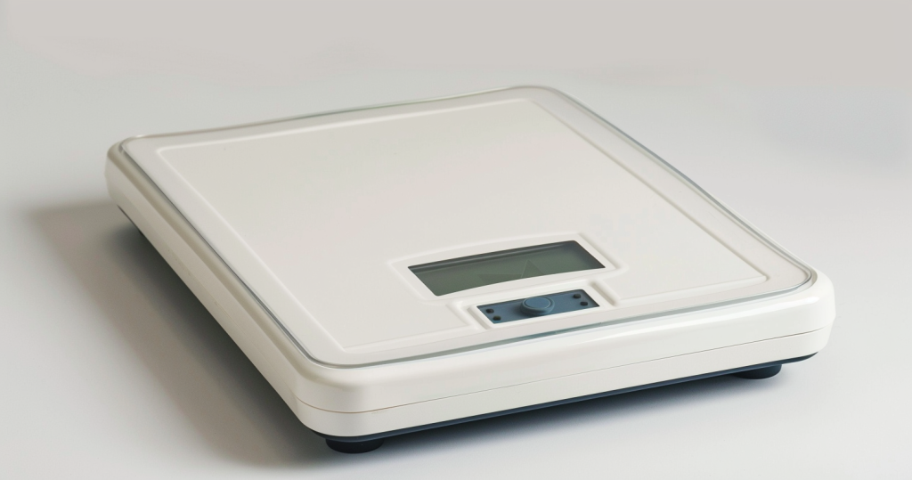 how accurate are body fat scales - photo of a scale that measures weight and body fat on a white background