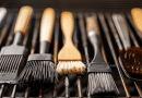 BBQ basting brush - photo of several different kinds of basting brushes laying on a bbq grill
