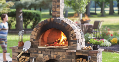 Outdoor pizza oven setup in a backyard with pizza tools and people socializing around. pizza oven safety