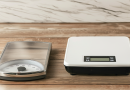 analog vs digital scale side by side on a wood table